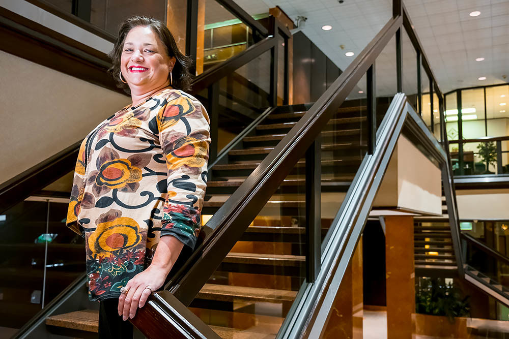 STANDING TALL: Kelsi Hall, president of Plaza Realty & Management Services LLC, says The Tower Club renovation is part of a larger update to the 30-year-old landmark.