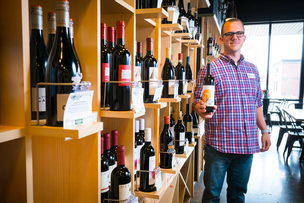 CHEERS: Matt Bekebrede holds a bottle of The Matriarch, Vino Cellars’ first private-label wine.