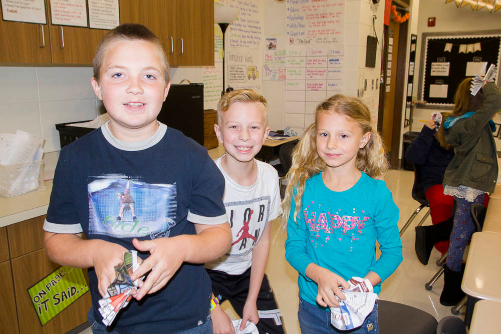 Adopt-A-Class
Springfield Business Journal visits the third-grade Ozark South Elementary class SBJ adopted through an Ozark Chamber of Commerce program connecting businesses and students. Above, students Jacob Irby, Aidan Elliott and Anna Grevtsov hold their Christmas ornaments made with pages of SBJ.