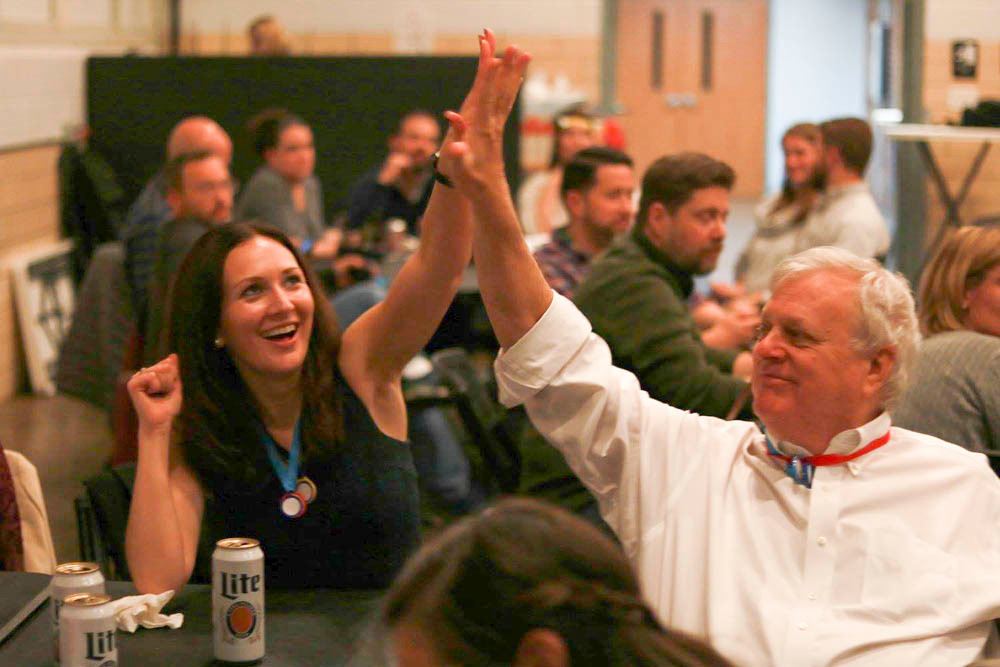 Megan Creson high-fives Craig Lowther to celebrate an answer on the way to Lowther Johnson Attorneys at Law taking first place at the Springfield Metropolitan Bar Association’s trivia night Nov. 10 at The Fairbanks.