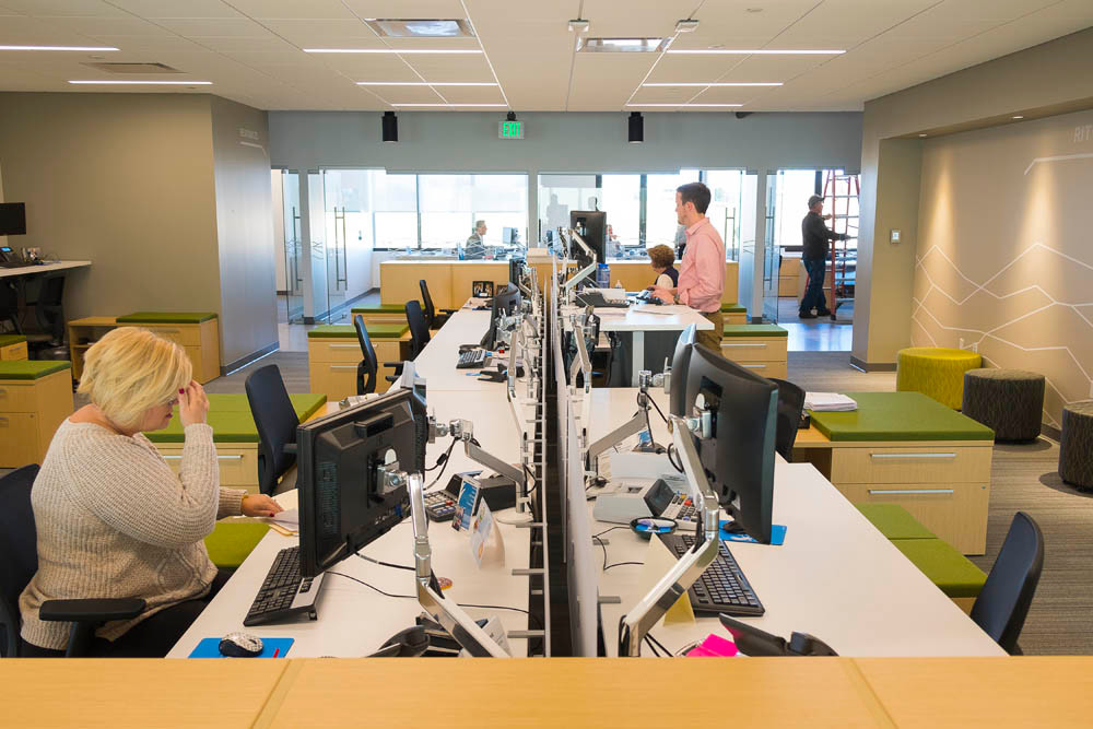 Flex
Adjustable desks allow employees to either sit or stand during the workday. Desk spaces also include colorful boxes that act as seating and storage, which can move on wheels.