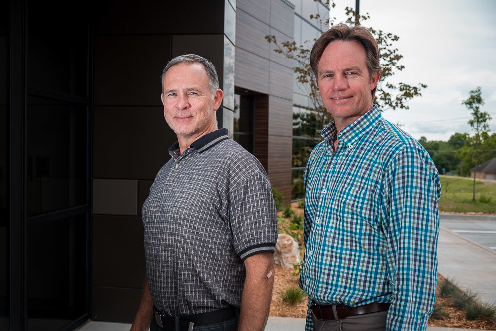 Tim O'Reilly, right, and David Ransin co-own the 4045 E. Sunshine St. building that houses their firms.SBJ photo by WES HAMILTON