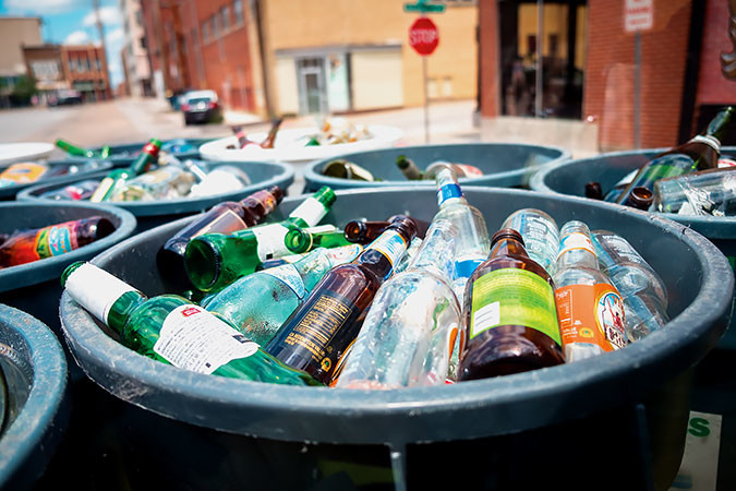 GONE GLASS: Barrels of glass bottles from downtown bars head to the city’s Public Works compound before going to Kansas City for recycling.
