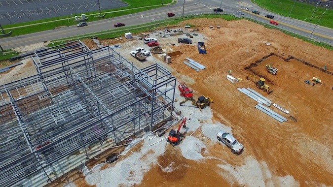 Aerial footage posted by Larry Snyder & Co. shows steel erected for Magers Crossing’s larger building and dirt work underway for a second building. The smaller structure facing Republic Road would house Great American Taco Co.Photo courtesy LARRY SNYDER & CO.
