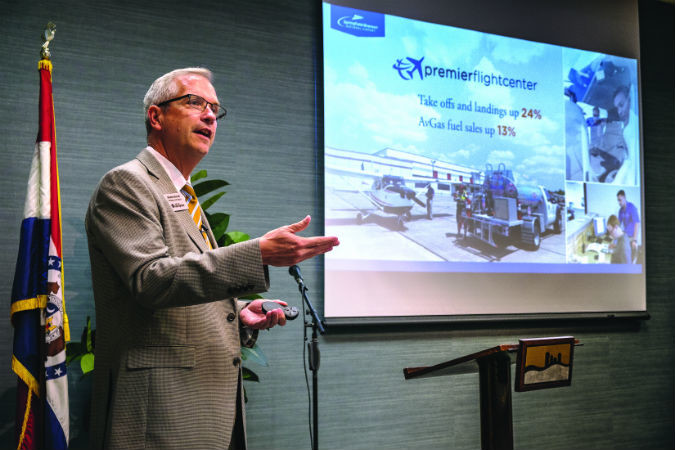 TAKING FLIGHT: During his State of the Airport address, Springfield Aviation Director Brian Weiler shows the airport’s 30 percent passenger growth in the last five years.SBJ photo by WES HAMILTON