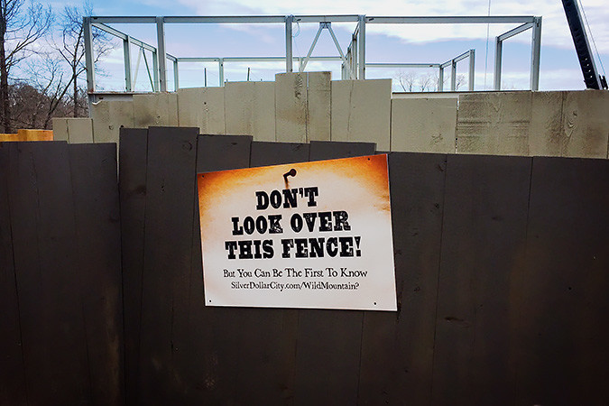 NO PEEKING?: A sign teases patrons of Silver Dollar City. Behind the fencing, the makings of a new ride are visible.Photo provided by SILVER DOLLAR CITY