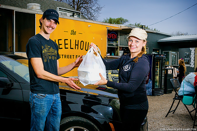 NEW WHEELS: Daniel Adam Smith delivers food for The Wheelhouse. Co-owner Melissa Smallwood says the move has bolstered winter sales.