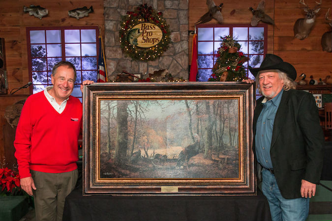 Bass Pro Shops founder Johnny Morris honors country music star John Anderson as Conservation Partner of the Year.