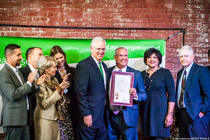 Gov. Jay Nixon presents the Certified Work Ready Community designation to Greene County Presiding Commissioner Bob Cirtin and other government leaders.