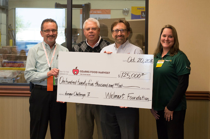 Wal-Mart officials present a $125,000 grant to Ozarks Food Harvest President and CEO Bart Brown, second from right.Photo provided by OZARKS FOOD HARVEST