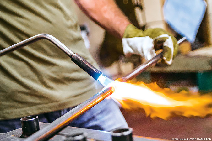 FIRED UP: The Forge LLC builds about 300 motorcycle parts annually from its Pleasant Hope shop with more than $80,000 in projected 2016 revenue.