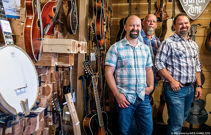 MORE THAN 1 STRING: Jeremy Chapman, left, Gene Hoke and John Chapman led The Acoustic Shoppe LLC to $259,000 in 2015 revenue.