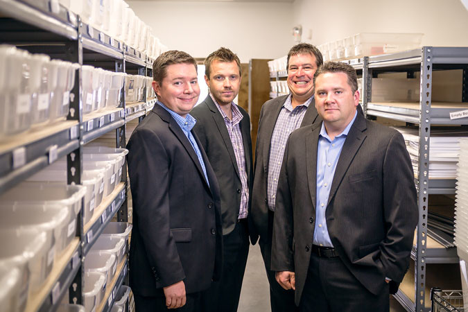 Nathan Mindeman, left, director of operations; Robert Lister, vice president of finance; Jeff Russell, president and owner; and Darin Wray, vice president of operations