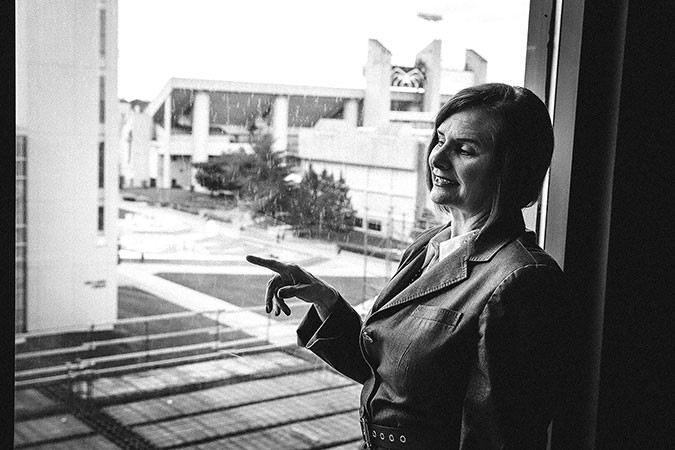 Stephanie Bryant looks out over the ongoing construction of Glass Hall’s $26 million expansion outside the COB computer lab.