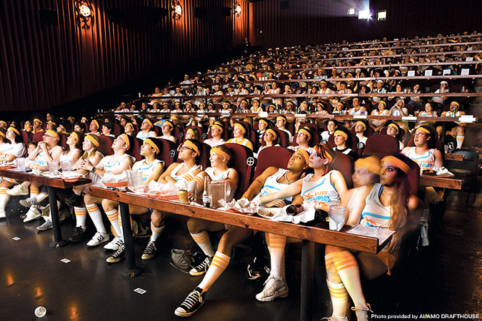 Costumed moviegoers attend a screening of “Semi-Pro” at the nine-screen Alamo Drafthouse South Lamar in Austin, Texas.