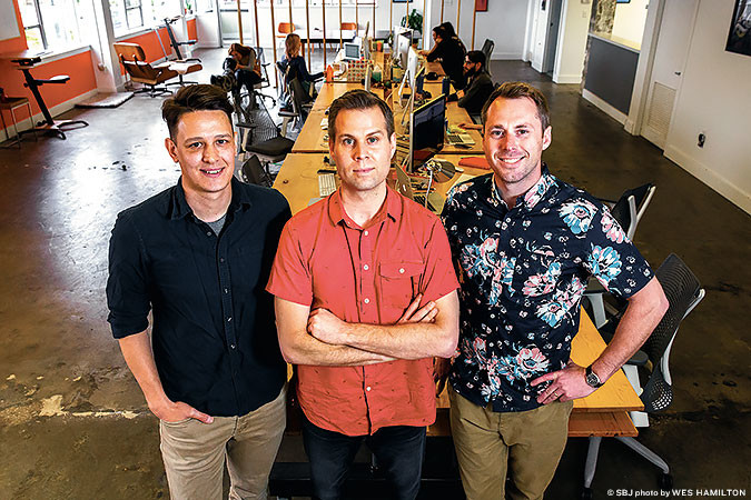 DIGITAL SPACE: From their downtown office, Mostly Serious owners Jarad Johnson, Joe Donohue and Clay McGee are preparing for the Give Ozarks nonprofit fundraiser and a new website for CoxHealth.