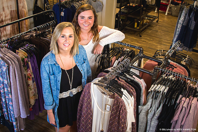 Mark Ashton LLC opens its second retail store, five years after launching its first at Branson Landing. Pictured, left to right, are Jenny Baker and Courtney Kuehn.