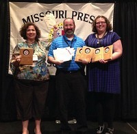 Left to right, SBJ Publisher Jennifer Jackson, reporter Brian Brown and Features Editor Emily Letterman accept Better Newspaper Contest awards.Photo by ADAM LETTERMAN