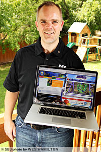 Michael Wehrenberg enjoys working at times from the deck of his home just east of Springfield.