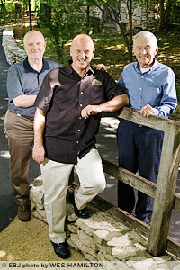 Pete Herschend, co-owner; Brad Thomas, general manager; and Jack Herschend, co-owner