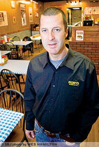 Scott Taylor, owner of two area Dickey's Barbecue Pit eateries, says he was compelled to help former employees at the shuttered Wing Shack.