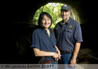 Wanetta and Kevin Bright take a breather from providing tours inside the mouth of Smallin Civil War Cave in Ozark. The couple in 2009 purchased the cave property, which now includes a visitors' center and gift shop. The Brights estimate 9,500 people visited the cave in 2011.