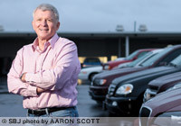 Tom Schaefer and a business partner bought the 166 Auto Auction in October. At least six acquisitions in the last three months are giving rise to positive economic prospects in 2012.