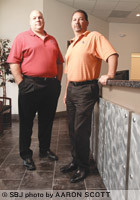 Ryan McCoy, left, and John Horton are approaching eight years as business partners in Layer 3 Technology. The computer networking and consulting company moved to a new office in April.