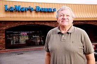 Ray's Donuts owner Bill Risberg stands in front of the shop that still bears the name of his former franchise. Risberg said he hopes a lawsuit, by either himself or LaMar's, won't come as a result of his breakup with the franchisor.
