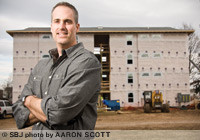Matt Miller, a partner in Miller-O'Reilly Co. Inc., says lease-by-the-bedroom apartments are common in college towns. His company's Walnut Quads, to be finished this summer, will have eight units and 32 bedrooms that can be individually leased.