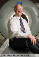Donald Babb, executive director and CEO of Citizens Memorial Healthcare in Bolivar, is at home in front of the 64-slice CT scanner in the remodeled radiology department. Babb worked in radiology early in his career.
