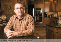Chad Holgerson of Keystone Building and Design used cabinets and hardwood floors with a water-soluble finish and high-efficiency doors and windows to remodel Geoff and Sally Branch's kitchen in Springfield's Woodbridge subdivision.