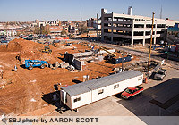 Progress continues on the College Station entertainment district, seen here from the roof of the neighboring parking deck. The Heer's parking deck, rear, is set to open in April.