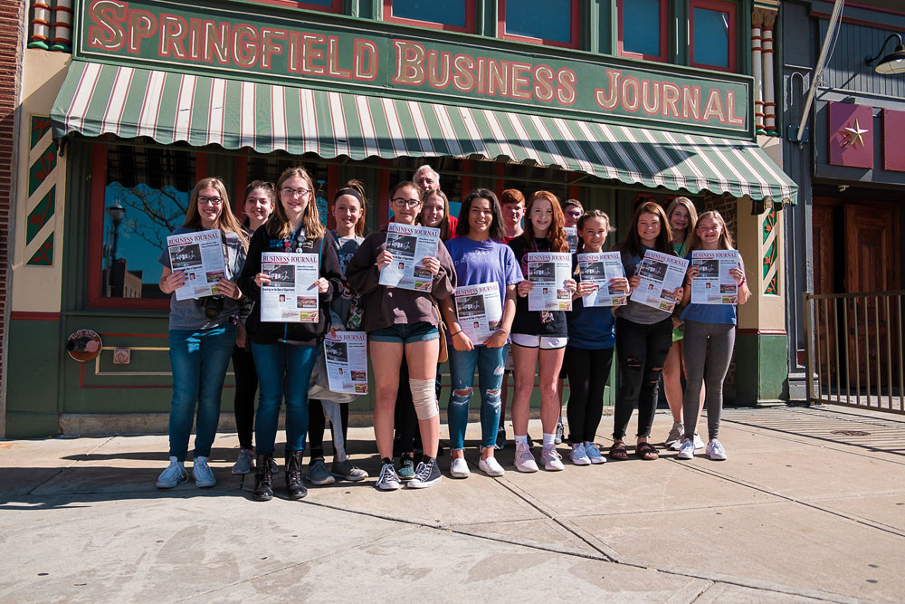 START THE PRESSES
Nixa Junior High’s journalism class, above, finishes a tour of Springfield Business Journal on April 27.