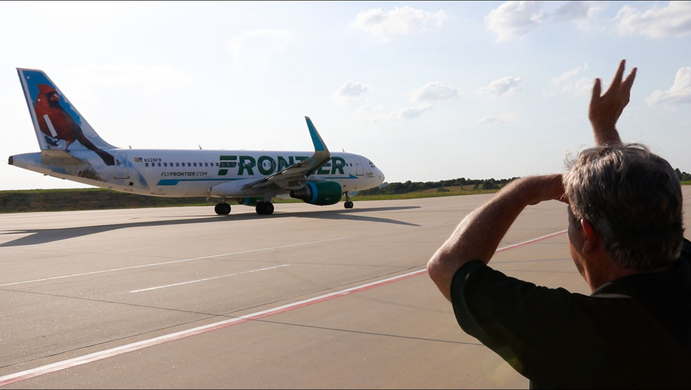Takeoff
Frontier Airlines resumes flight service to Branson Airport on June 13, after a hiatus since 2014. Above, crew members give the “Branson wave” as passengers depart to Denver International Airport.