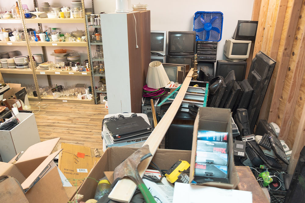 An area of the shop is filled with breakable inventory the business acquires through estate sales and donations.