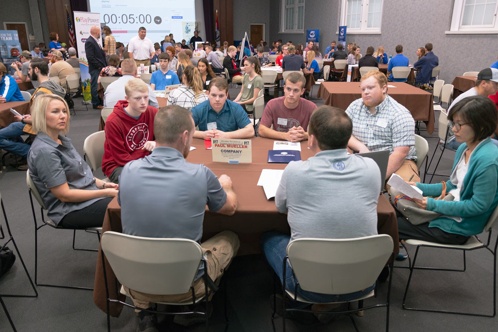 JOB FAIR ALTERNATIVE: Ozarks Technical Community College students visit with Paul Mueller Co. representatives at an Oct. 4 speed-dating-style jobs event.