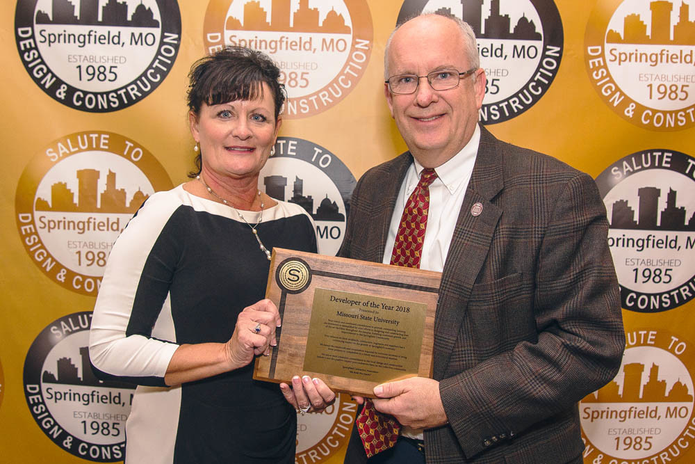 Construction Salute
Design Fabrication Inc. owner Dianna Devore, at left, presents the Springfield Contractors Association Developer of the Year Award to Missouri State University, accepted by MSU President Clif Smart, at the Nov. 13 Salute to Design and Construction banquet.