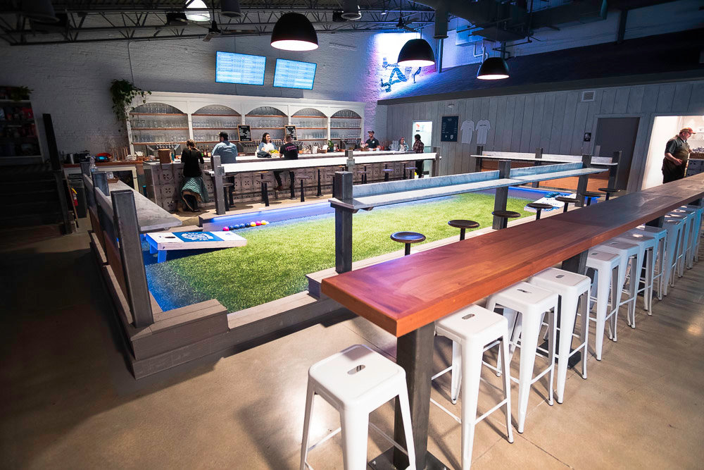 Central to Best of Luck Beer Hall is an indoor synthetic grass court.