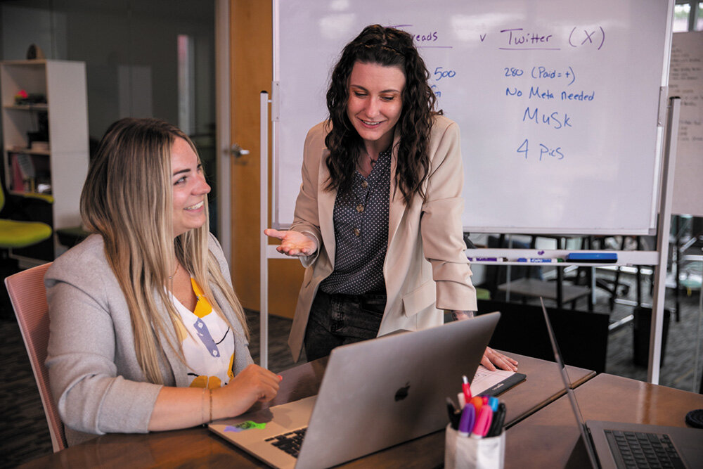 STRATEGIC APPROACH: Hiveminded Marketing’s Bethany Dean, left, and Sheri Walsh say businesses should determine what social platforms their target market is using when developing a marketing strategy.