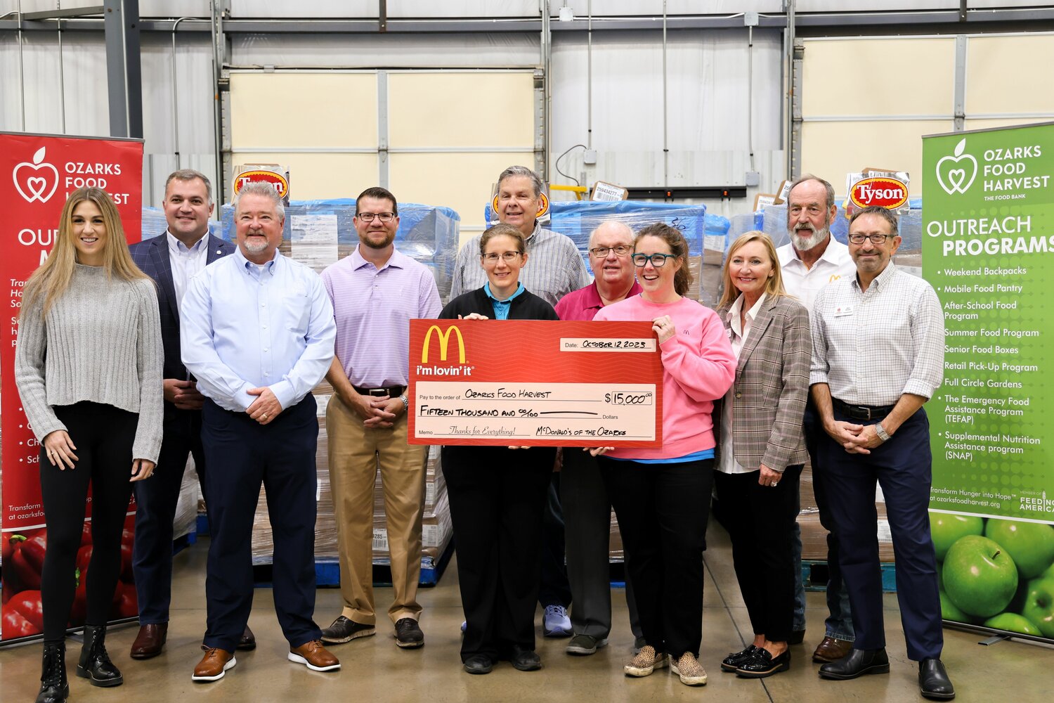 Officials with McDonald’s, Tyson Foods Inc. and iHeartRadio Springfield present donations of $15,000 and 40,000 pounds of chicken to Ozarks Food Harvest.