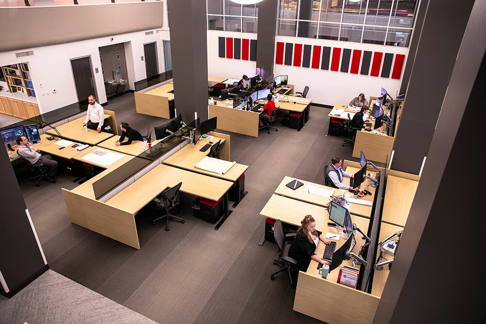 20-Foot View: The view from the 20-foot mezzanine level shows the studio work environment for several of BRP’s roughly 20 employees. On the far wall, officials added the acoustic tiles with a splash of the firm’s signature red color.