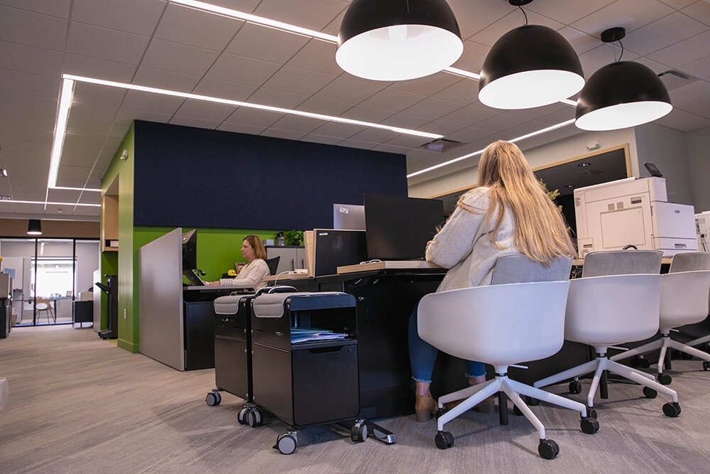 Room to Loan: With large and bright lights illuminating the space, loan operations staff have ample room to operate. Several of the building’s interior walls are painted in deep blue and warm green, which officials dub navy and lime, to match the bank’s signature colors.