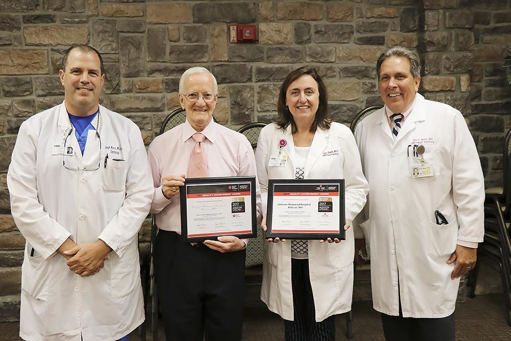 Heart HealthyThe American Heart Association honored Citizens Memorial Healthcare’s dedication to cardiac care quality with two awards. The gold and bronze honors are given for demonstrating excellent patient outcomes for 12 consecutive months and implementing specific quality improvement measures for heart attack patients. Pictured are Dr. Joseph Moore, left, CEO Donald Babb, Jane Smith and Dr. John Best.