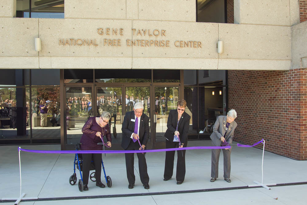 Welcome Free Enterprise
Officials on Sept. 7 cut the ribbon on Southwest Baptist University’s expanded Gene Taylor National Free Enterprise Center and dedicated its Robert W. Plaster College of Business and Computer Science. Jill McLoud, in honor of her late husband Tom, contributed financially to the new 11,318-square-foot wing, which includes five classrooms, four presentation rooms, a computer lab and a student lounge. Pictured, from left, are Dolly Plaster Clement, SBU President C. Pat Taylor, McLoud and the Rev. Barbara Clemmons.