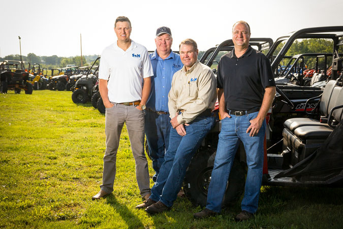 Caleb Wehrman, left, general manager; Max Stephans, ag sales manager; Kenny Bergmann, corporate sales manager; and Eric Schnelle, president