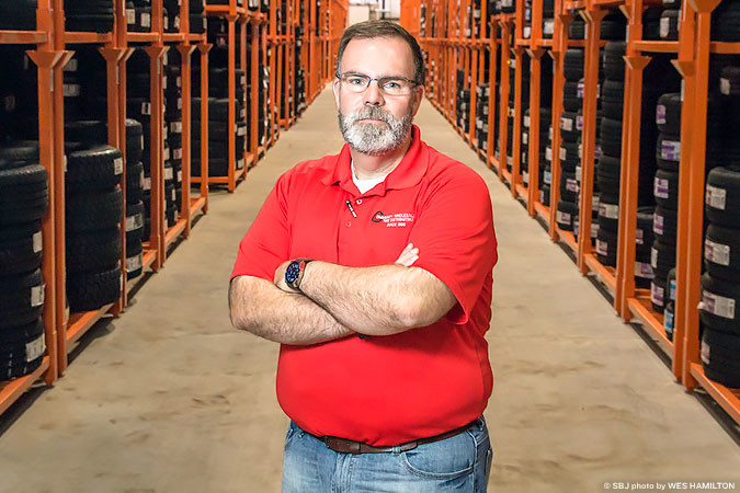 Bryan Littrell manages Community Wholesale Tire’s new warehouse in North Creek Business Park.