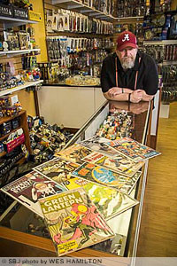 Comic Cave owner Josh Roberts says his Fremont Center shop houses some 20,000 comic books, including a Green Lantern collector item valued at $300.