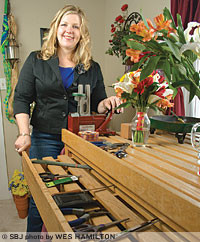 Theresa Carter, owner of RosAmungThorns LLC, works from her north Springfield home designing floral arrangements for her startup business.