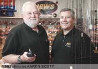 Lynn Reeves, left, holds a Lew's reel next to business partner Gary Remensnyder, at their retail store, Sportman's Factory Outlet, 2253 E. Bennett St. They teamed up in early 2010 to sell Lew's and Mr. Crappie brands to such retailers as Cabela's and Academy Sports.Click here for more photos.